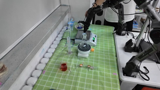 A robot working at a laboratory bench